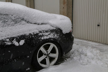 Car covered with snow after heavy snowfall