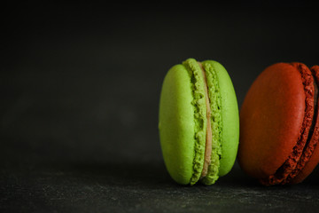 macaron or macaroon cake, colorful cookies (dark background). copy space