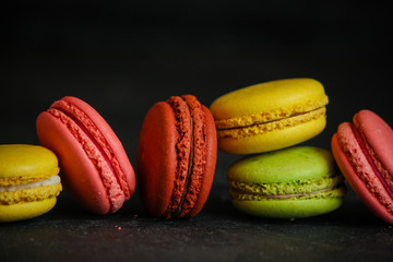 macaron or macaroon cake, colorful cookies (dark background). copy space