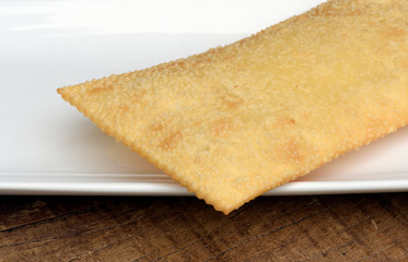 Brazilian food: pastel on white platter