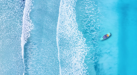 Beach and waves from top view. Turquoise water background from top view. Summer seascape from air....