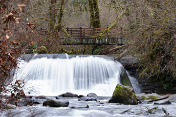 Lower McDowell Falls with wooden bridge at Mcdowell Creek Fall at County In Oregon