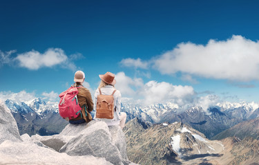 Travelers couple look at the mountains landscape. Travel and active life concept with team....