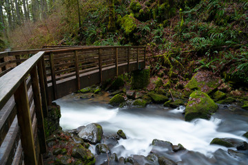 Majestic Fall with wooden boardwalk at McDowell Creek Fall County Park in Oregon