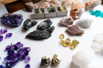 Fototapeta na wymiar Collection of beautiful precious stones on white table.