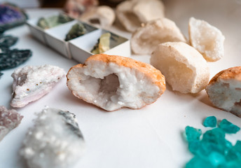 Collection of beautiful precious stones on white table.