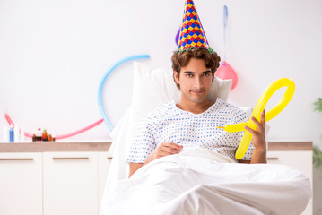 Young man celebrating his birthday in hospital