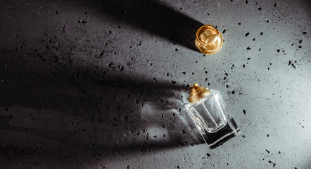 Top view of a perfume bottle and a plug separately. Concept of caring and health. Buying perfumes,...