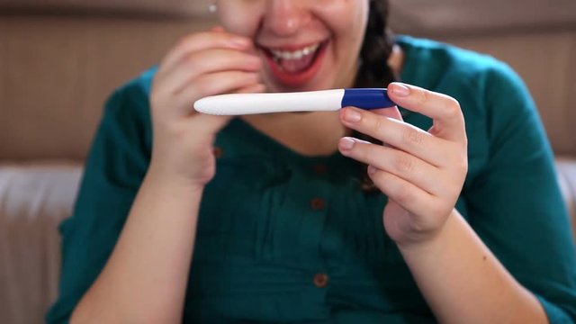 Excited Woman Gets Positive Pregnancy Test Result