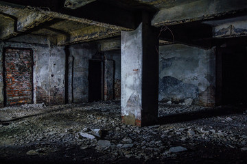 Fototapeta na wymiar Dark and creepy dirty abandoned underground basement