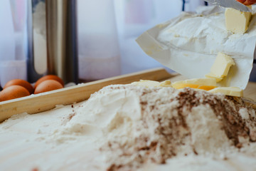 Help children during baking and cooking. The child helps to prepare the dough for baking. Baking cookies, family baking together. Flooding, making cookies. The concept of cooking.