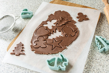 Cooking Christmas gingerbread cookies on a gray background