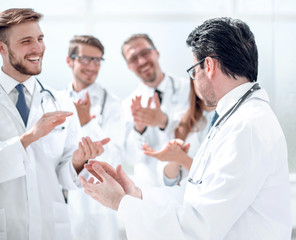 group of doctors applauding each other