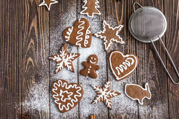 Christmas tree made from gingerbread cookies on a wooden background. New year and christmas postcard