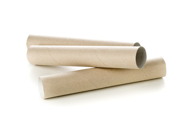 Two empty, used, brown cardboard roll tubes over white
