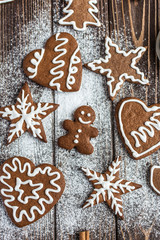Christmas homemade gingerbread cookies on a wooden background. New year and christmas postcard