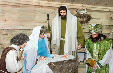 Christmas doll show with a newborn baby Jesus Christ and his mother Mary. - 242052630