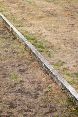 Boundary line in lawn made of limestone