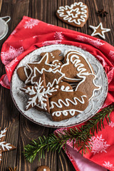 Christmas homemade gingerbread cookies on wooden background. New year and christmas postcard