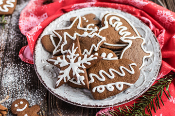 Christmas homemade gingerbread cookies on wooden background. New year and christmas postcard