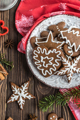 Christmas homemade gingerbread cookies on wooden background. New year and christmas postcard