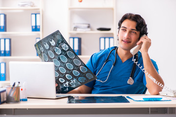 Young male doctor radiologist working at the clinic 