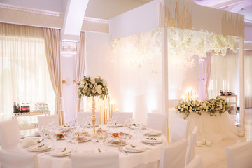 Decorated restaurant on the wedding day. Inside. Interiors