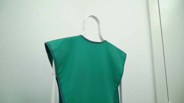 X-ray protection clothes. Green vest in radiology clinic.