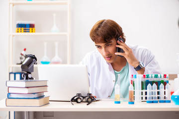 Young chemist working in the lab