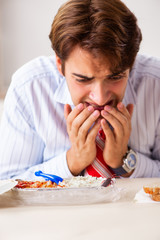 Employee eating food with cockroaches crawling around