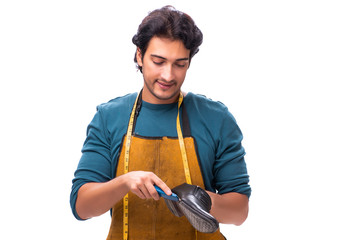 Young handsome shoemaker isolated on white