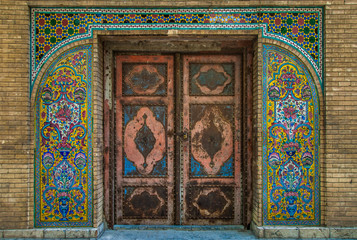 Mosaic traditional floral wall and old door
