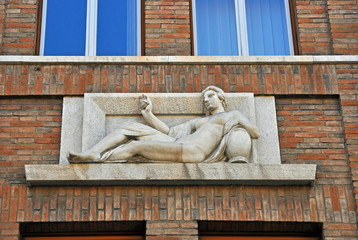 Italy  Ravenna  young lady sculpture on the National Insurance Institute building. Example of architecture during fascism.