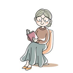 座って本を読む・シニア女性