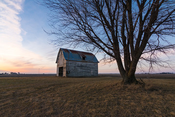 Old rustic barn as the sun sets.  Ogle County, Illinois, USA