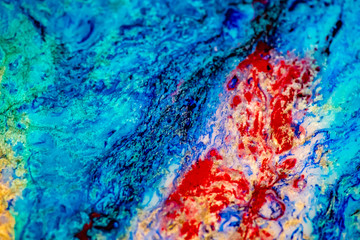 Poured Resin Abstract with multicolored cells and intricate details deep in the mix.