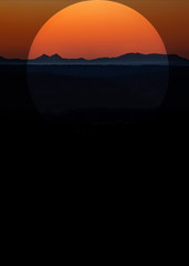 mountain imposed sunset silhouette