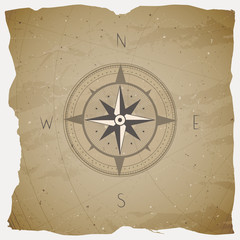 Vector illustration with a vintage compass or wind rose on grunge background.
