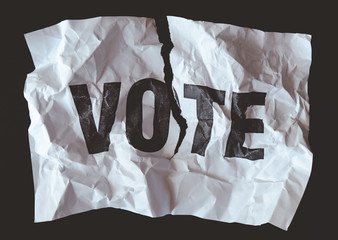 destroyed paper with word vote printed, crash of democracy concept