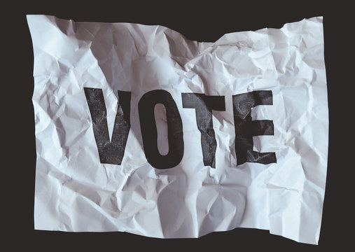 crumpled paper with&nbsp;word vote printed,&nbsp;collapse of democracy concept