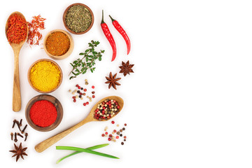 mix of spices in wooden spoon isolated on a white background with copy space for your text. Top view. Flat lay. Set or collection