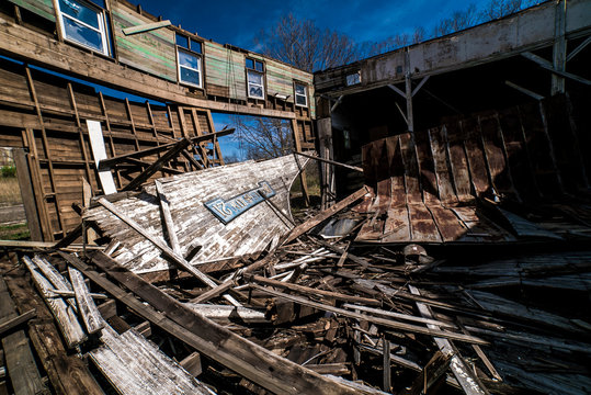 Abandoned gymnasium, kids football pads, score board numbers