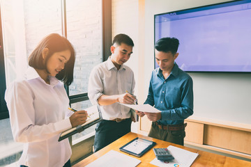 Business team meeting and discussing project plan. Businessmen discussing together in meeting room. Professional investor working with business project together. Finance managers task.