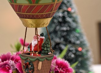 Santa is coming to town with a balloon