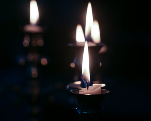 burning candles in the candelabra
