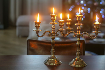 burning candles in the candelabra