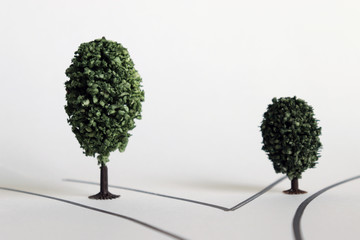 Two miniature trees with different crossings and different sizes.
