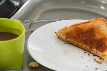 Boy eating grilled cheese sandwich.