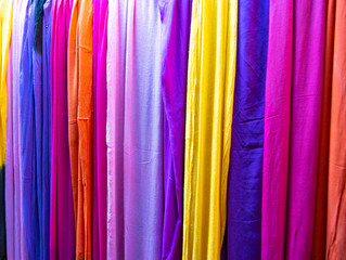 Traditional Colorful Moroccan scarves and shawls in Fes, Morocco also known as shesh (touareg turban). Handmade fabrics. Souk Fez. Close up scarfs market of the old medina in vibrant colors