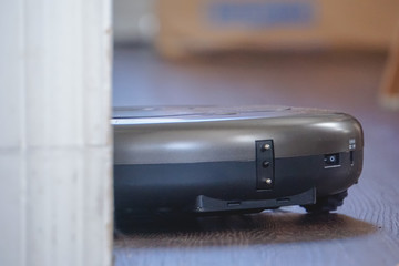 Closeup of robot vacuum cleaner low angle closeup.